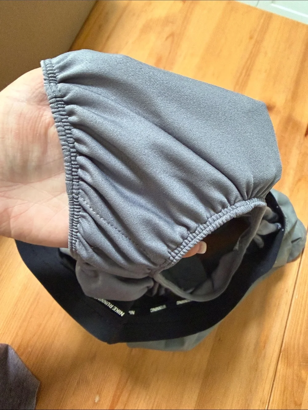 Nike Gray Athletic Shorts with Black Waistband and White Swoosh